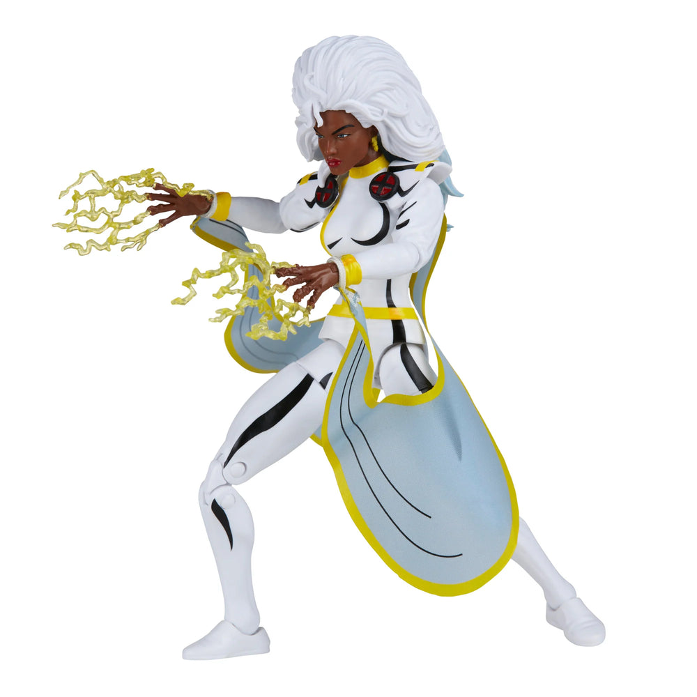 A 6-inch Marvel Legends Series X-Men Storm action figure in a classic white costume, accompanied by alternate hands with crackling electrical energy FX accessories, all contained in a '90s video cassette-inspired packaging.