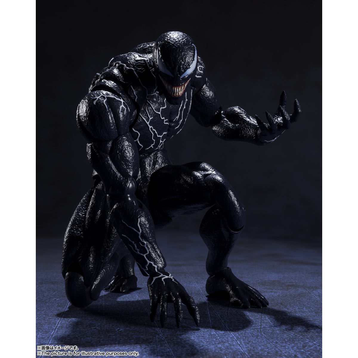 
                  
                    A detailed S.H.Figuarts Venom action figure standing 7.5 inches tall, with optional parts including three alternate head sculpts, two pairs of interchangeable hands, and two back tentacles. A bonus Venom symbiote head and pedestal are also displayed.
                  
                