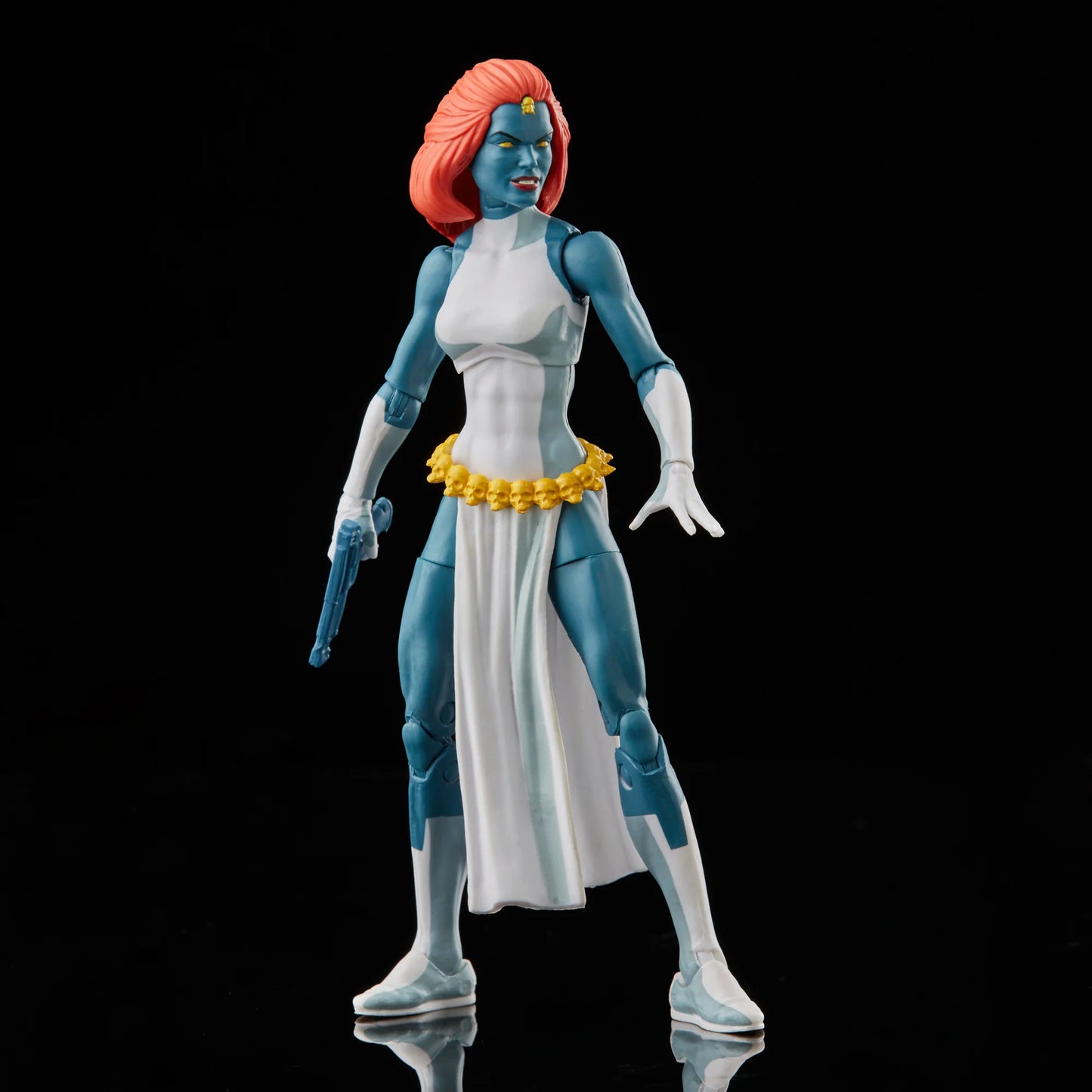 
                  
                    A 6-inch Marvel Legends Series X-Men Marvel's Mystique action figure with blue skin and yellow eyes, featuring accessories such as alternate hands, weapons, and a Baby Nightcrawler figure, all presented in a '90s video cassette-inspired packaging.
                  
                