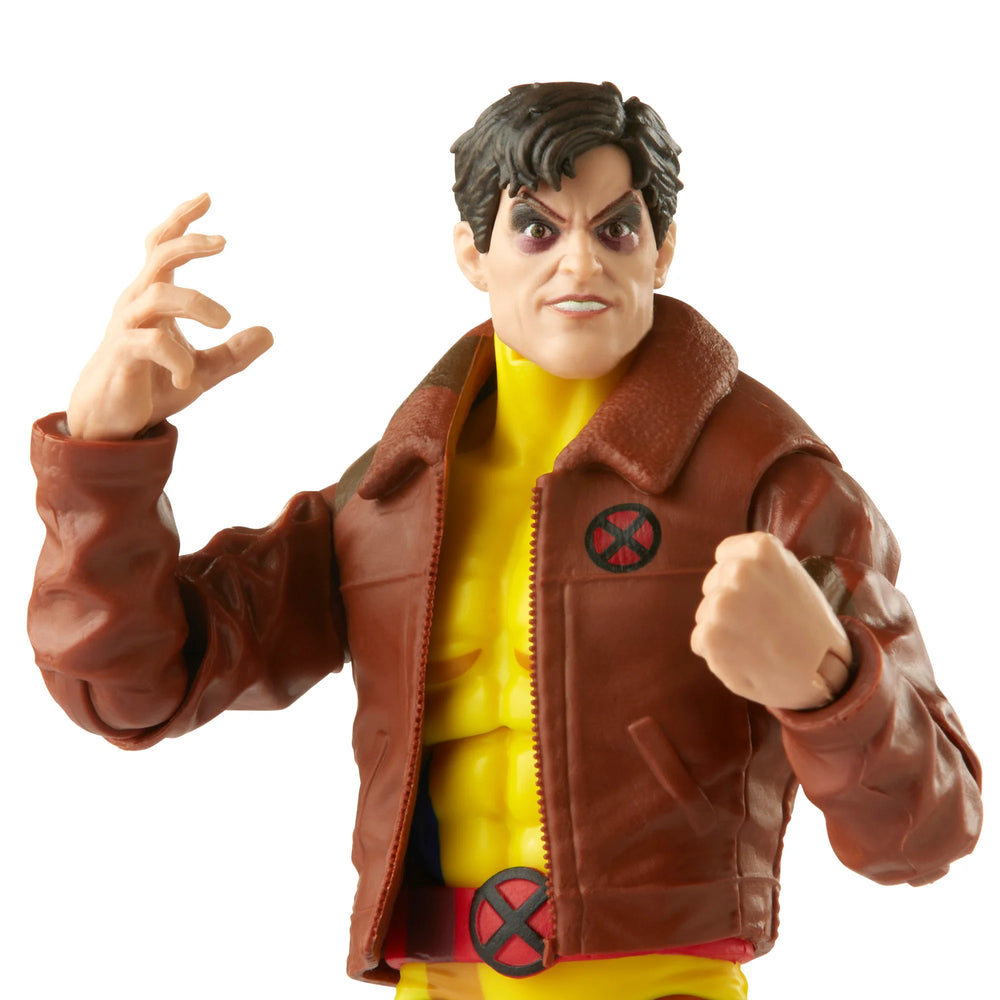 
                  
                    A 6-inch Marvel Legends Series X-Men Morph action figure in a classic uniform and jacket, accompanied by alternate hands and an alternate head accessory, all presented in a '90s video cassette-inspired packaging.
                  
                