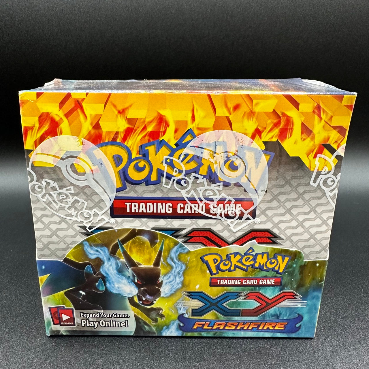 
                  
                    Image of a Pokémon TCG: XY—Flashfire Booster Box with fiery-themed illustrations, promising an exhilarating gameplay experience with the debut of Mega Charizard-EX.
                  
                