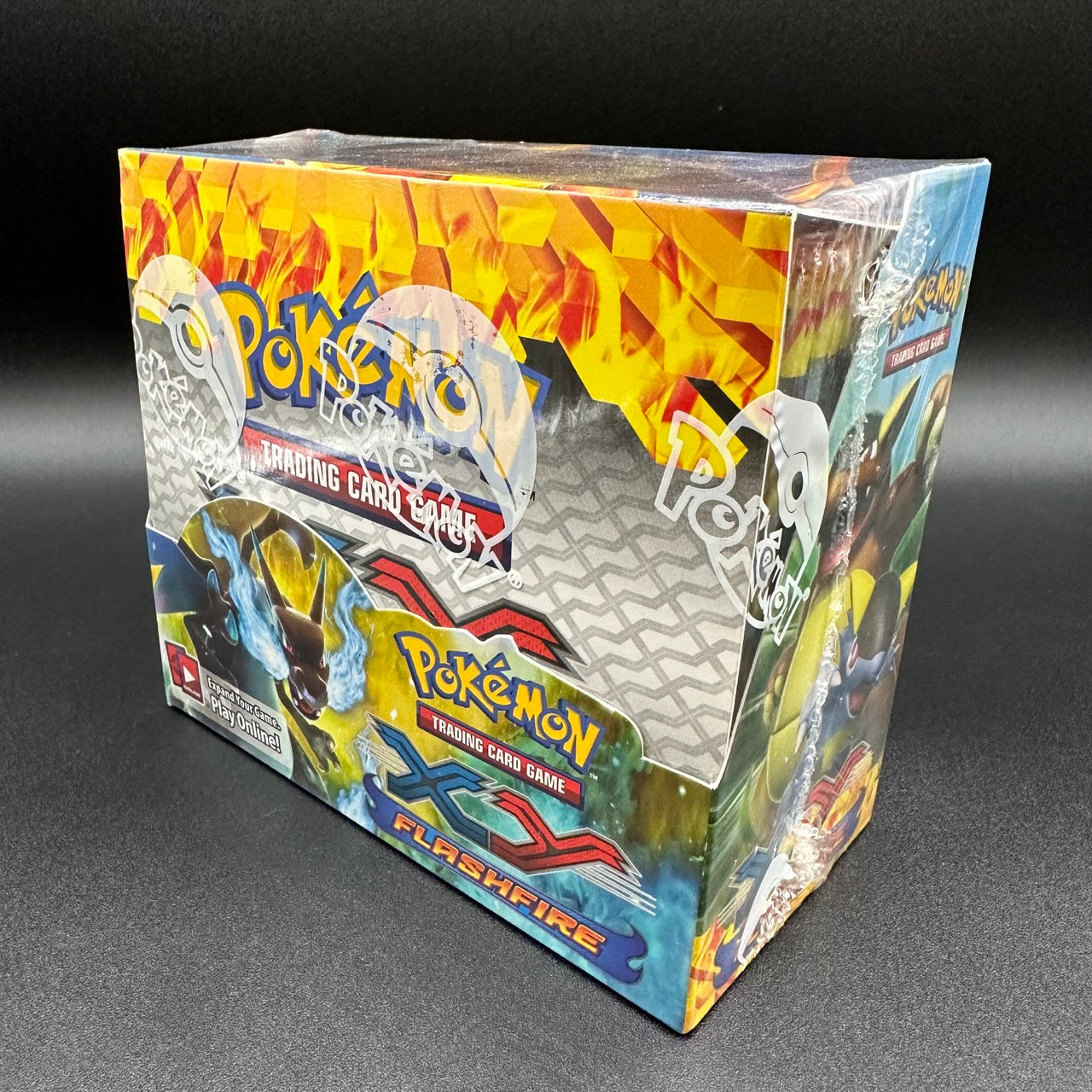 
                  
                    Image of a Pokémon TCG: XY—Flashfire Booster Box with fiery-themed illustrations, promising an exhilarating gameplay experience with the debut of Mega Charizard-EX.
                  
                