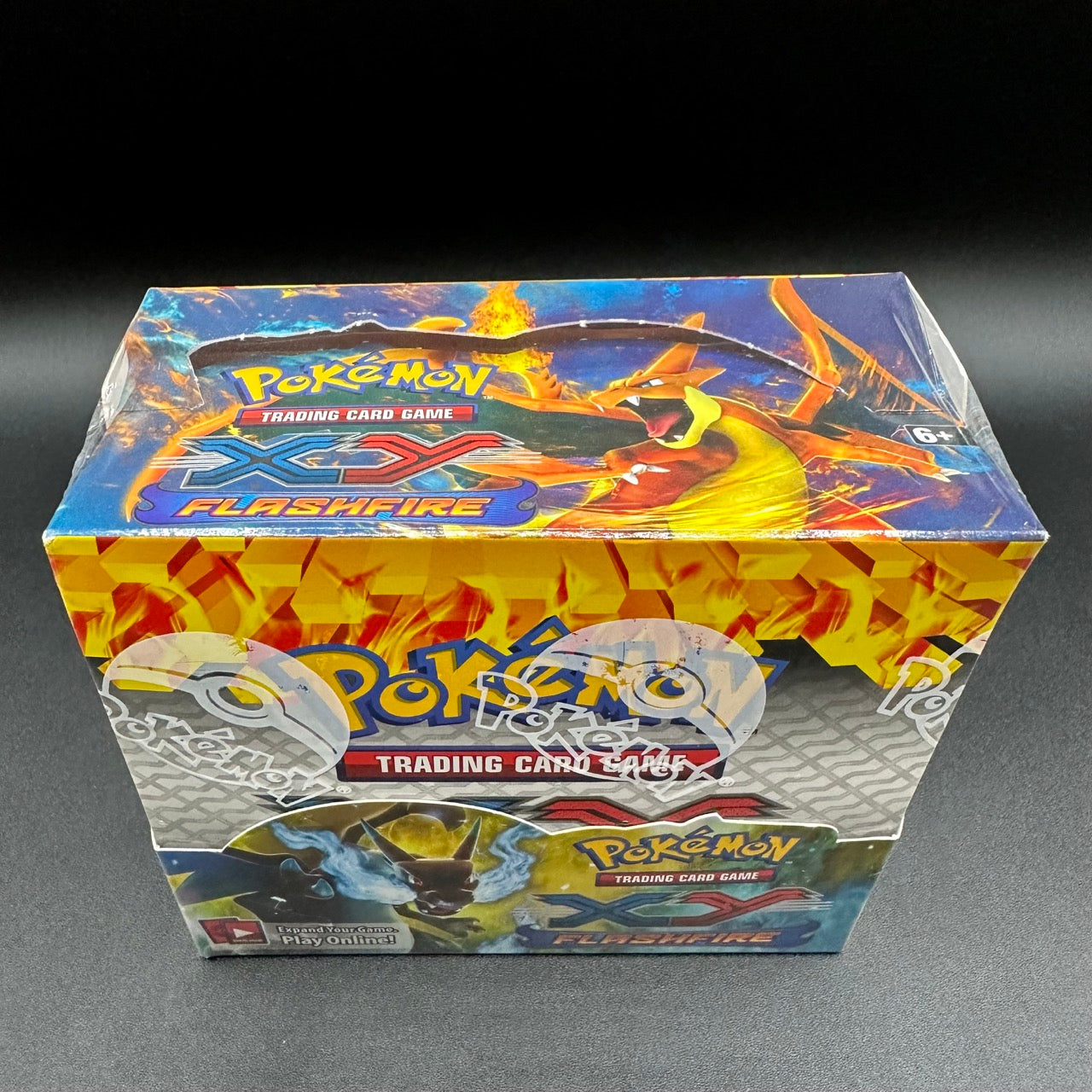 
                  
                    Image of a Pokémon TCG: XY—Flashfire Booster Box with fiery-themed illustrations, promising an exhilarating gameplay experience with the debut of Mega Charizard-EX.
                  
                