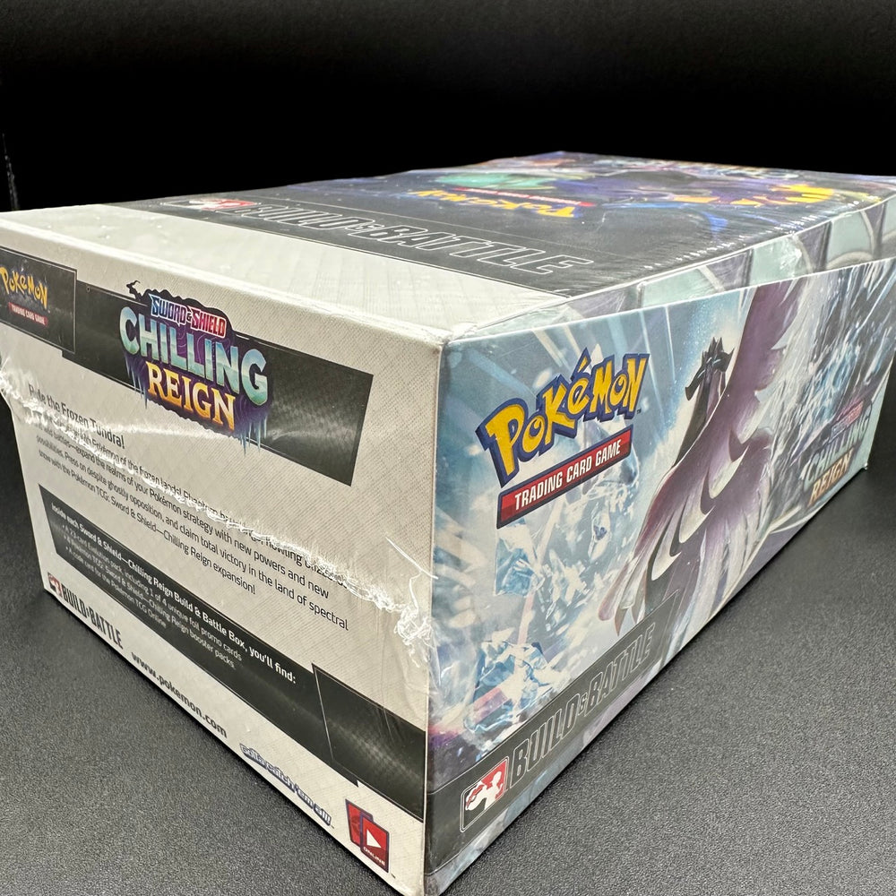 
                  
                    A factory-sealed box of the Sword & Shield Chilling Reign Build and Battle kit, containing a 23-card Evolution pack, four alternate-art promo cards, and four Pokémon TCG: Sword & Shield Chilling Reign booster packs.
                  
                