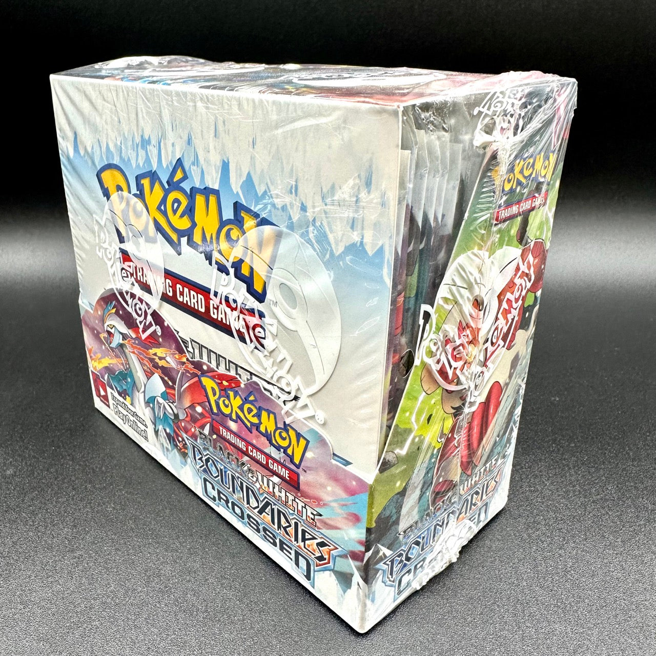 
                  
                    Image of a Pokémon Black and White Boundaries Crossed Booster Box, featuring 36 packs of 10 cards from the Boundaries Crossed expansion. Ideal for collectors and Pokémon players.
                  
                